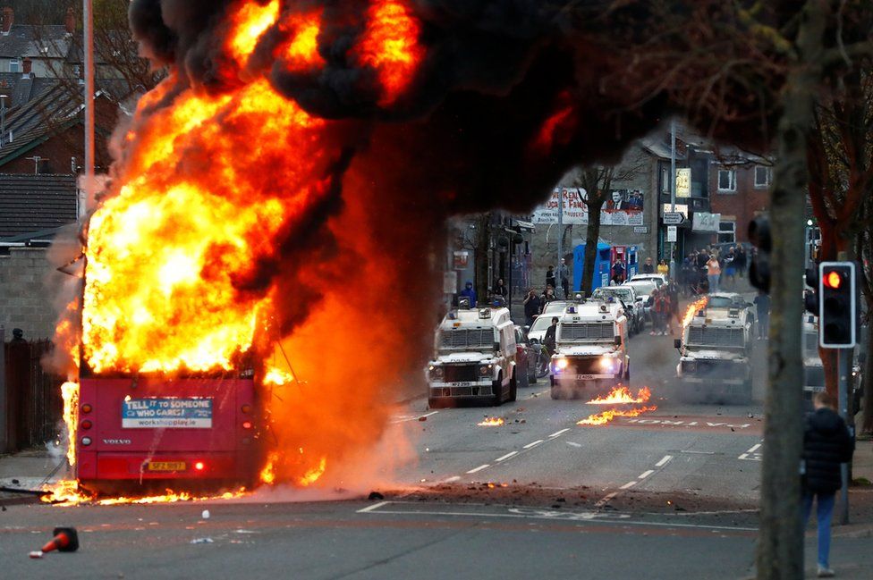 Rioters have hijacked a bus and set it on fire (Image: REUTERS)
