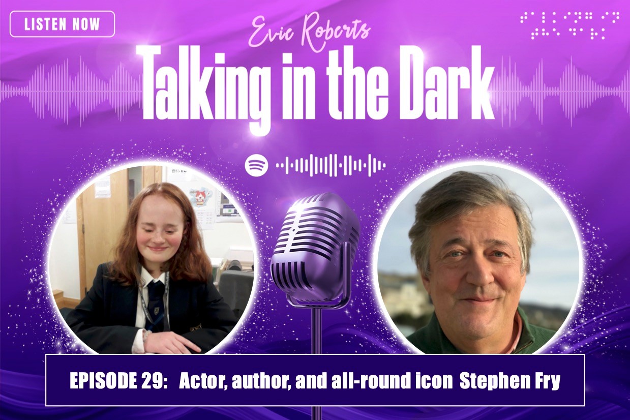 In the podcast graphic there is a purple background with the title ‘Talking in the Dark’ written in white top centre. There are also two distinct photographs on either side and in between them is an image of a microphone. The photograph on the left-hand side is of Evie who is sat behind a grey desk. Evie has shoulder length red hair and is smiling. She is wearing school uniform. The photograph on the right-hand side is of Stephen Fry. In the photograph Stephen is looking at the camera and smiling. He has short grey hair and is wearing a dark green sweater.